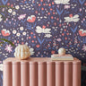 Purple gardens styled behind pink credenza in living space