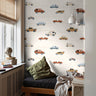 Driving cars in boho colors styled in boys bedroom