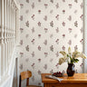 Rouselle House wallpaper close-up showing intricate maroon floral detailing and elegant matte finish by James & Colors