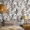 intricate leaves, blooms, and stems in muted tones of taupe, blush, and charcoal on a white background