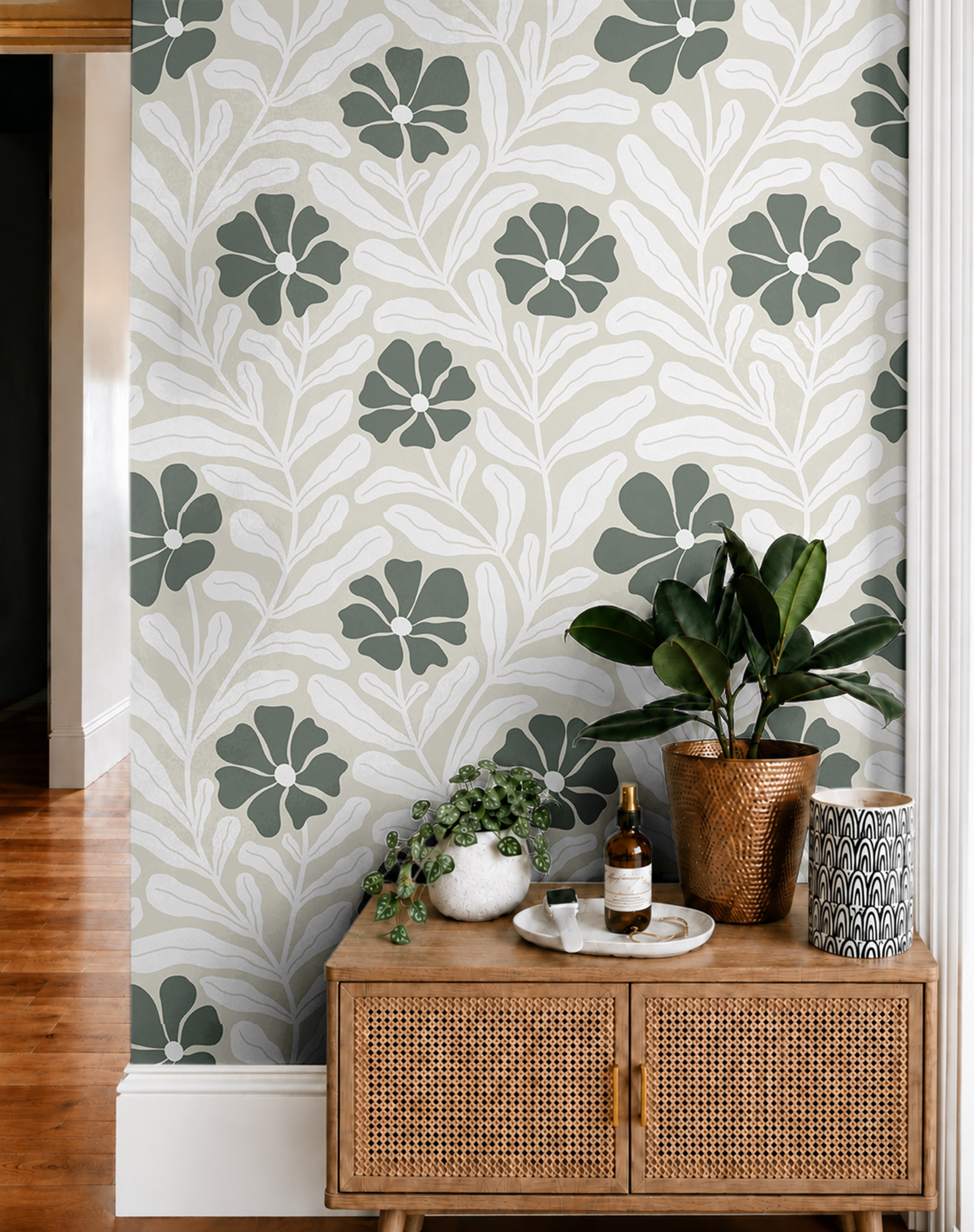 sage green wallpaper features modern leaf and petal forms in a repeating pattern that adds visual rhythm without overwhelming the space
