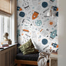 Colorful space rockets in boys reading nook