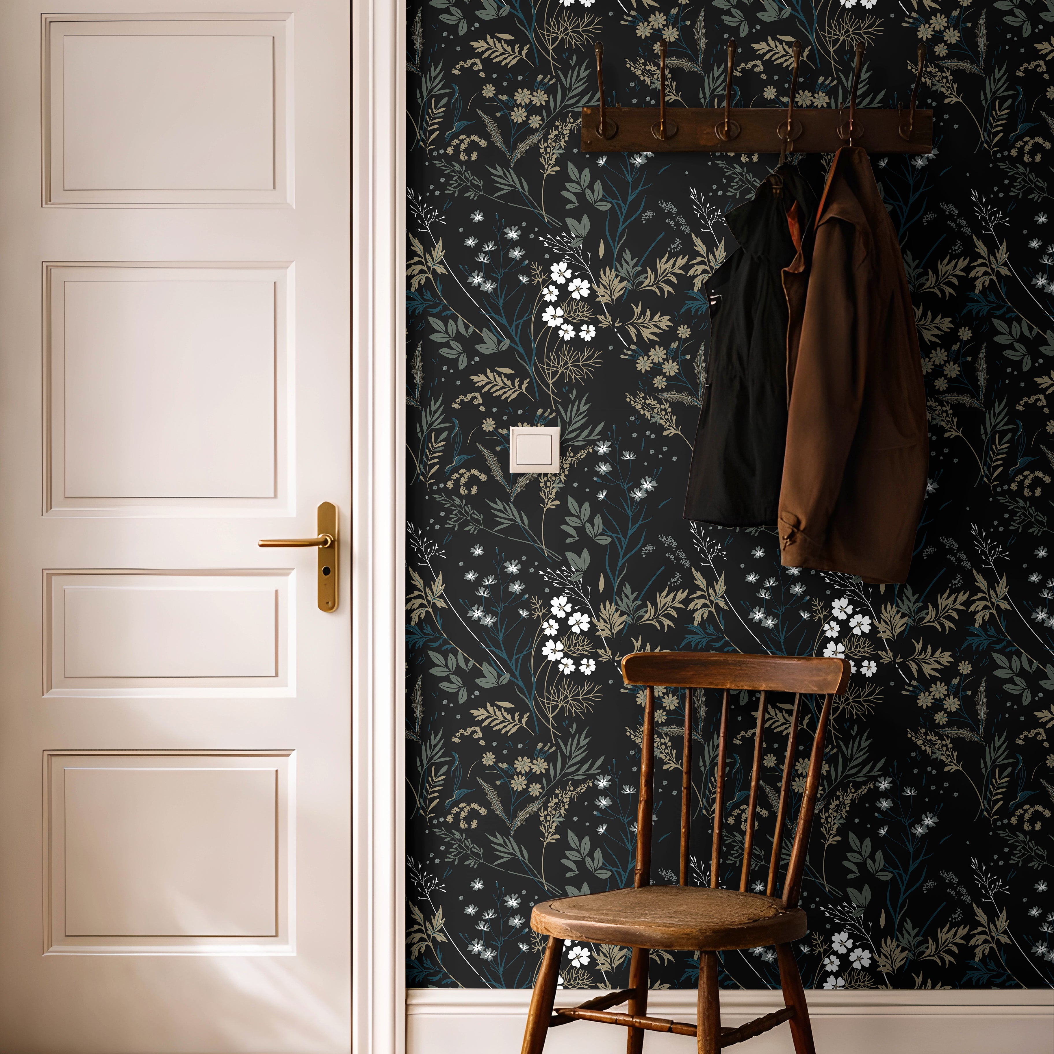 Moody florals with white accents styled in bright hallway with warm wooden accents