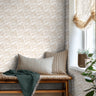 warm tan brushstrokes creating geometric pattern in day bed nook with a white background