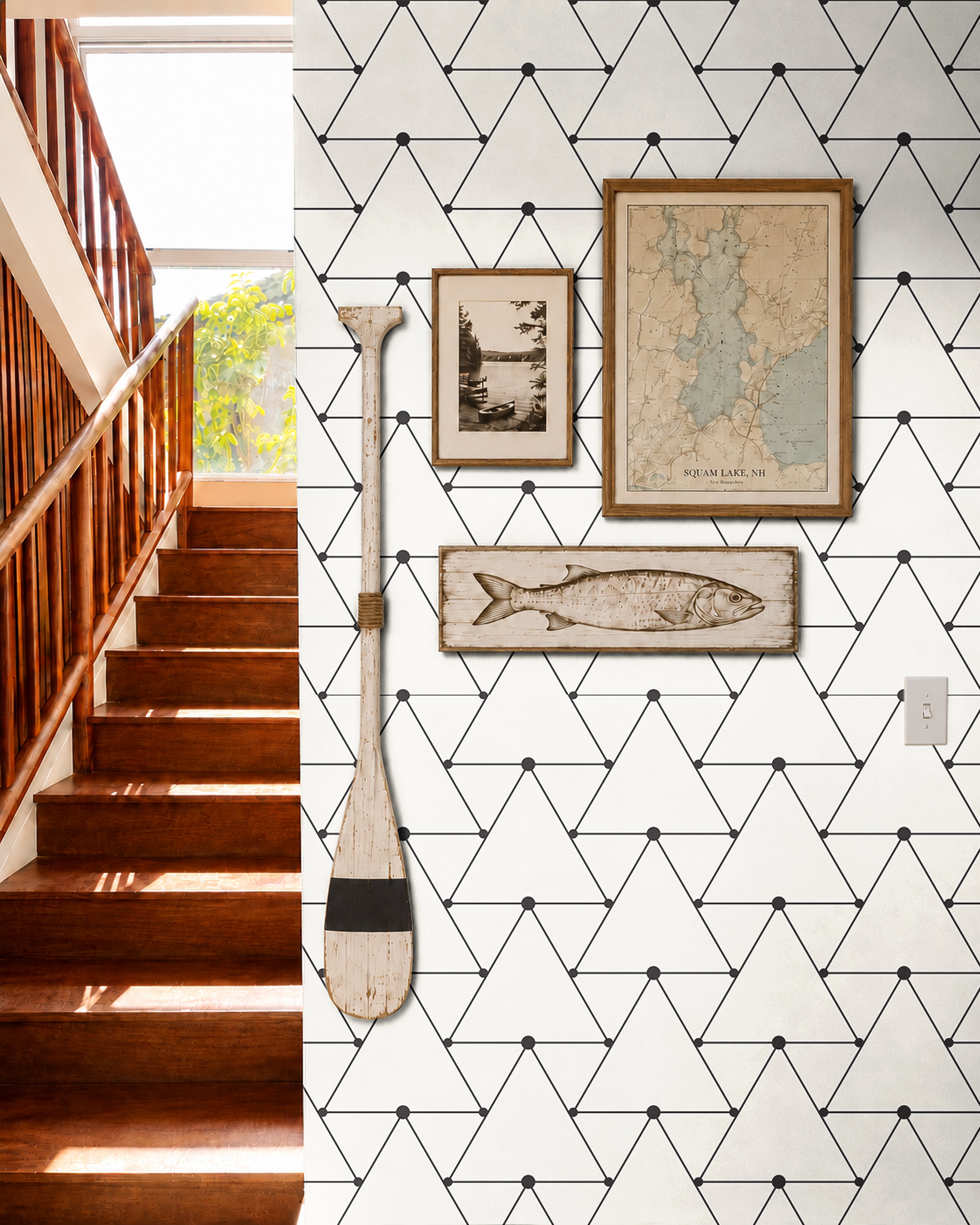 black geometric triangle outlines on white background in well lit nautical hallway