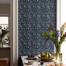 White hand drawn floral on deep navy background in a modern kitchen interior