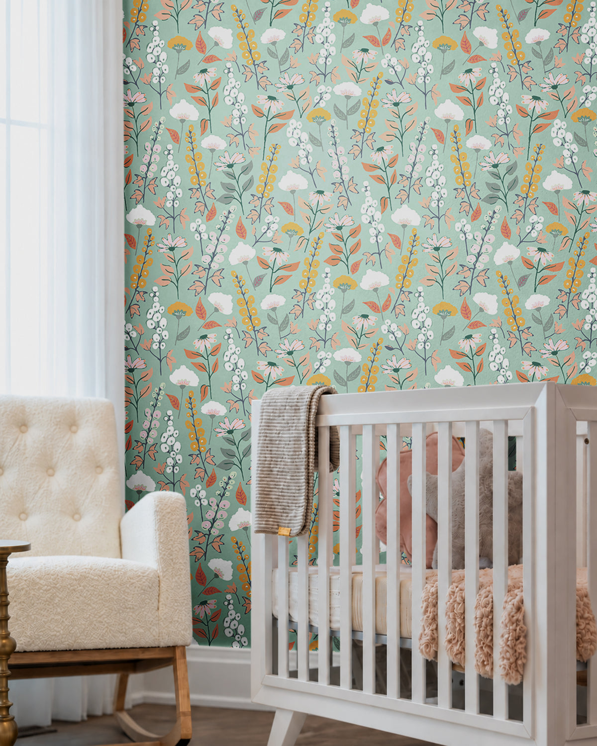 blue green background with orange pink and white wildflowers in nursery
