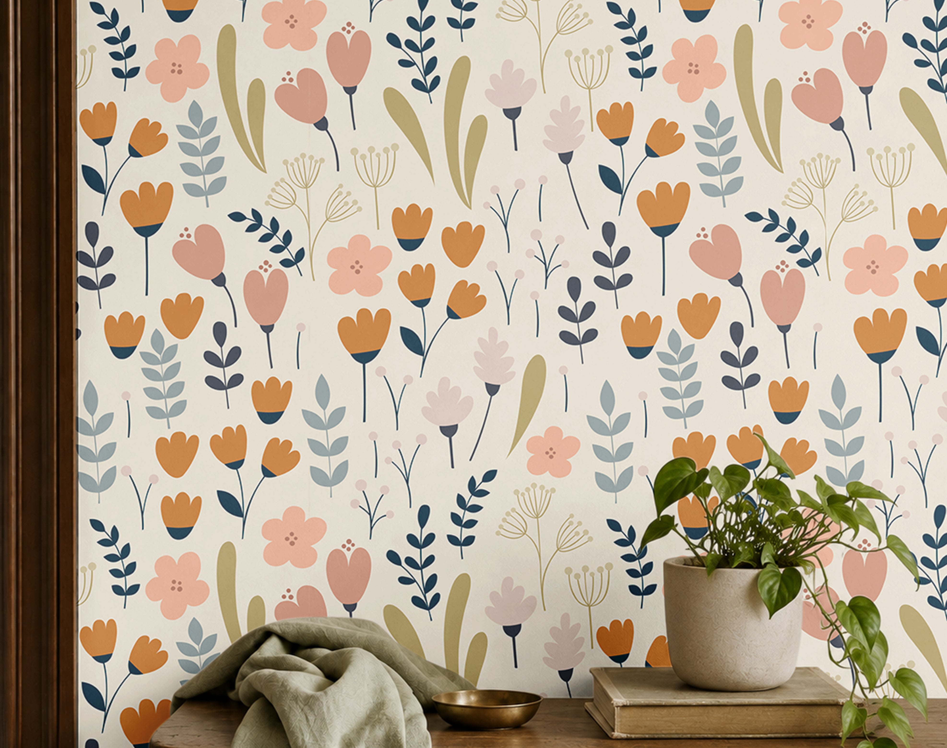 pocketful of posies cream floral wallpaper in an entryway with a wood bench, olive throw, and potted plant