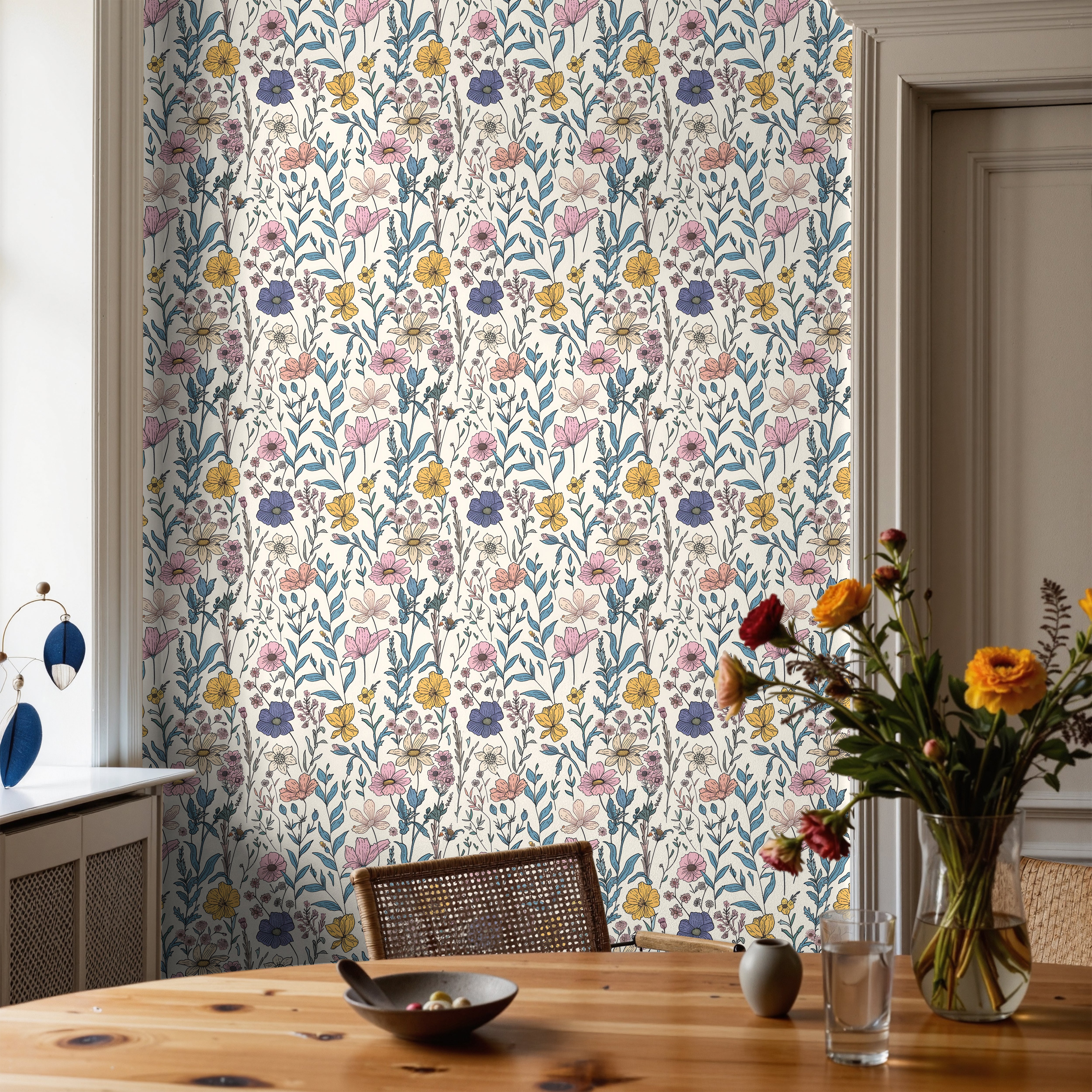 Vibrant purples, yellows, and pink florals on white background, with blue leaf accents