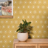 White boho suns on warm golden yellow background