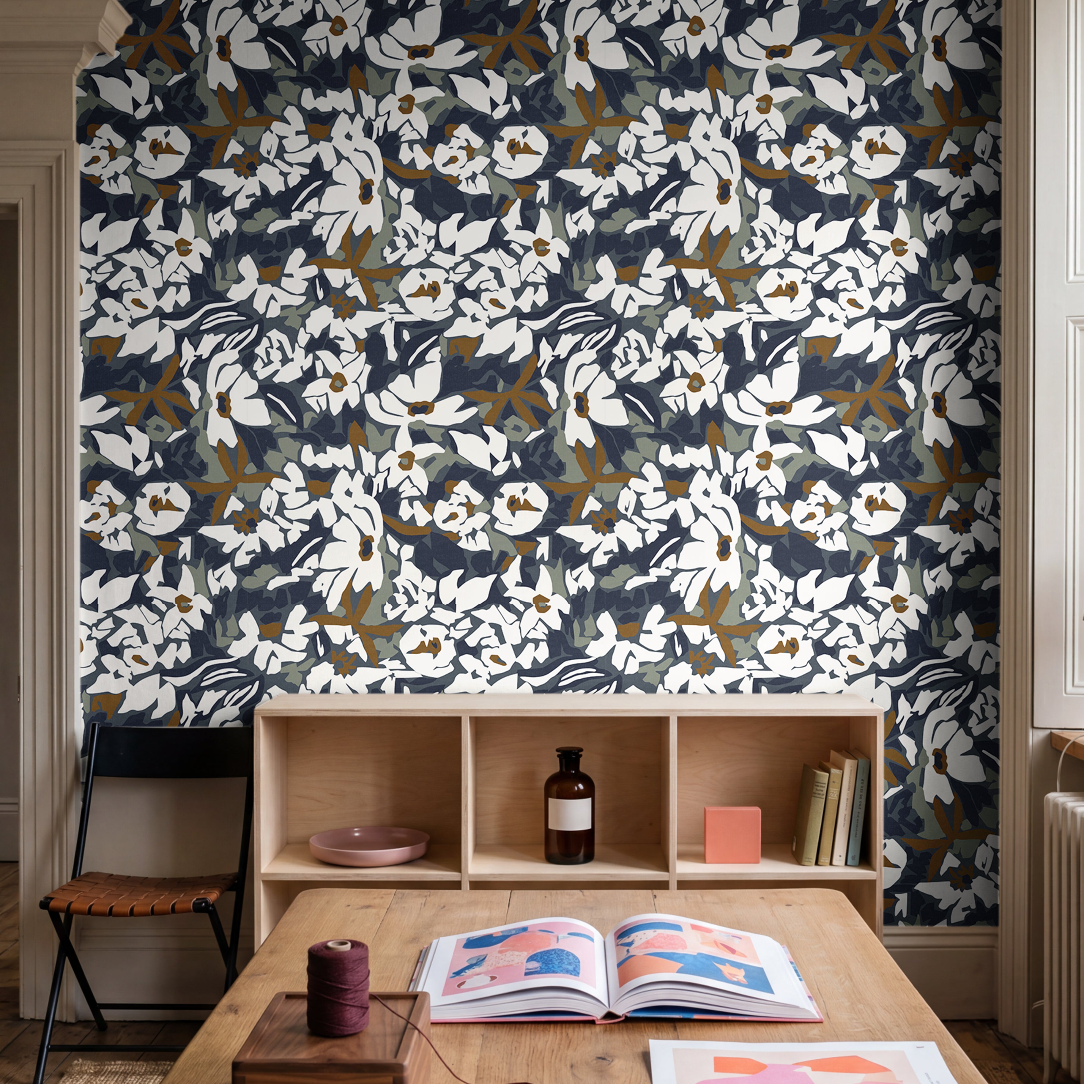  navy floral wallpaper with bold botanical pattern in modern playroom