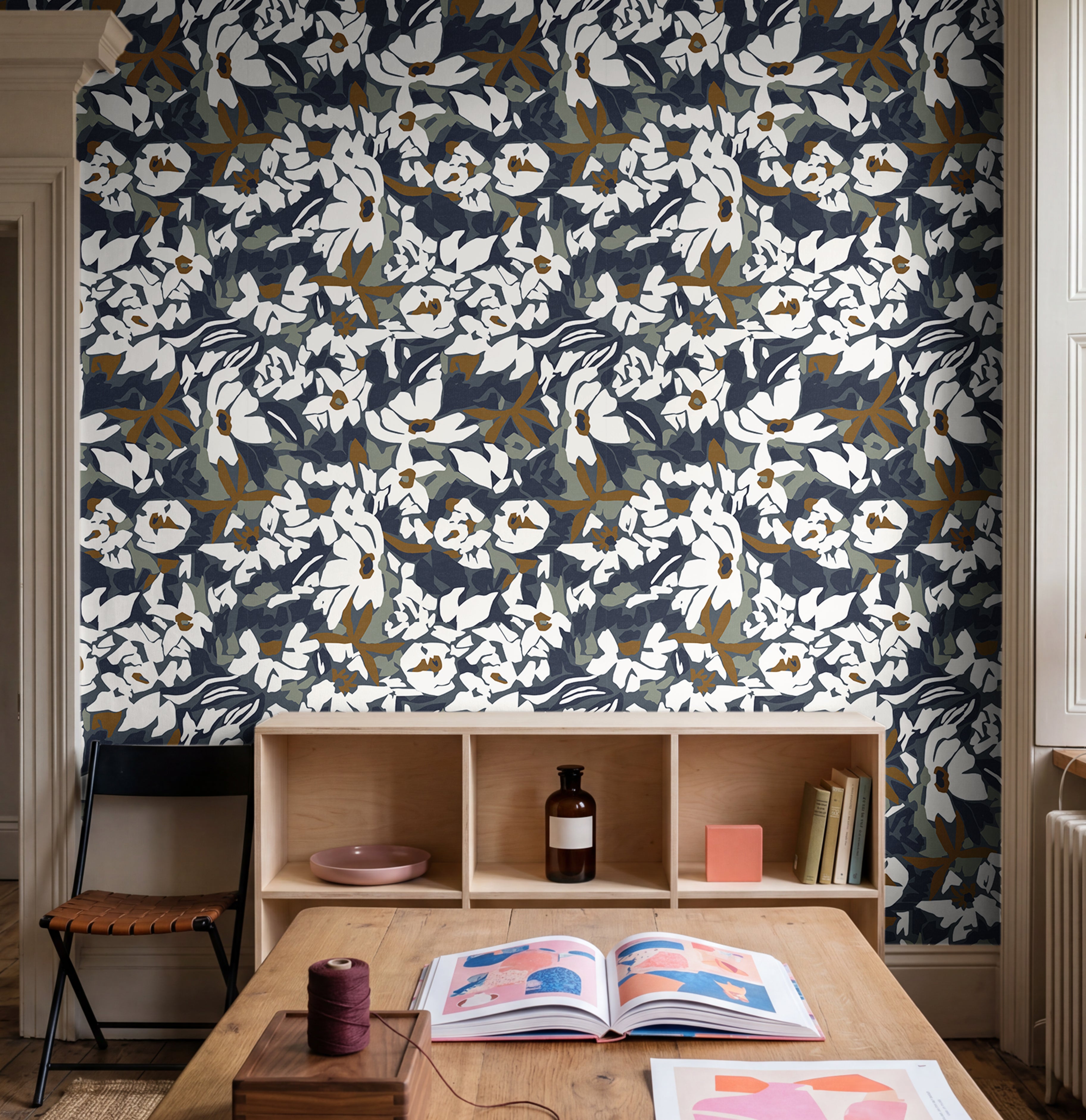  navy floral wallpaper with bold botanical pattern in modern playroom
