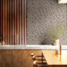 modern kitchen with ardenwall stone wallpaper and natural wood shelving – james & colors