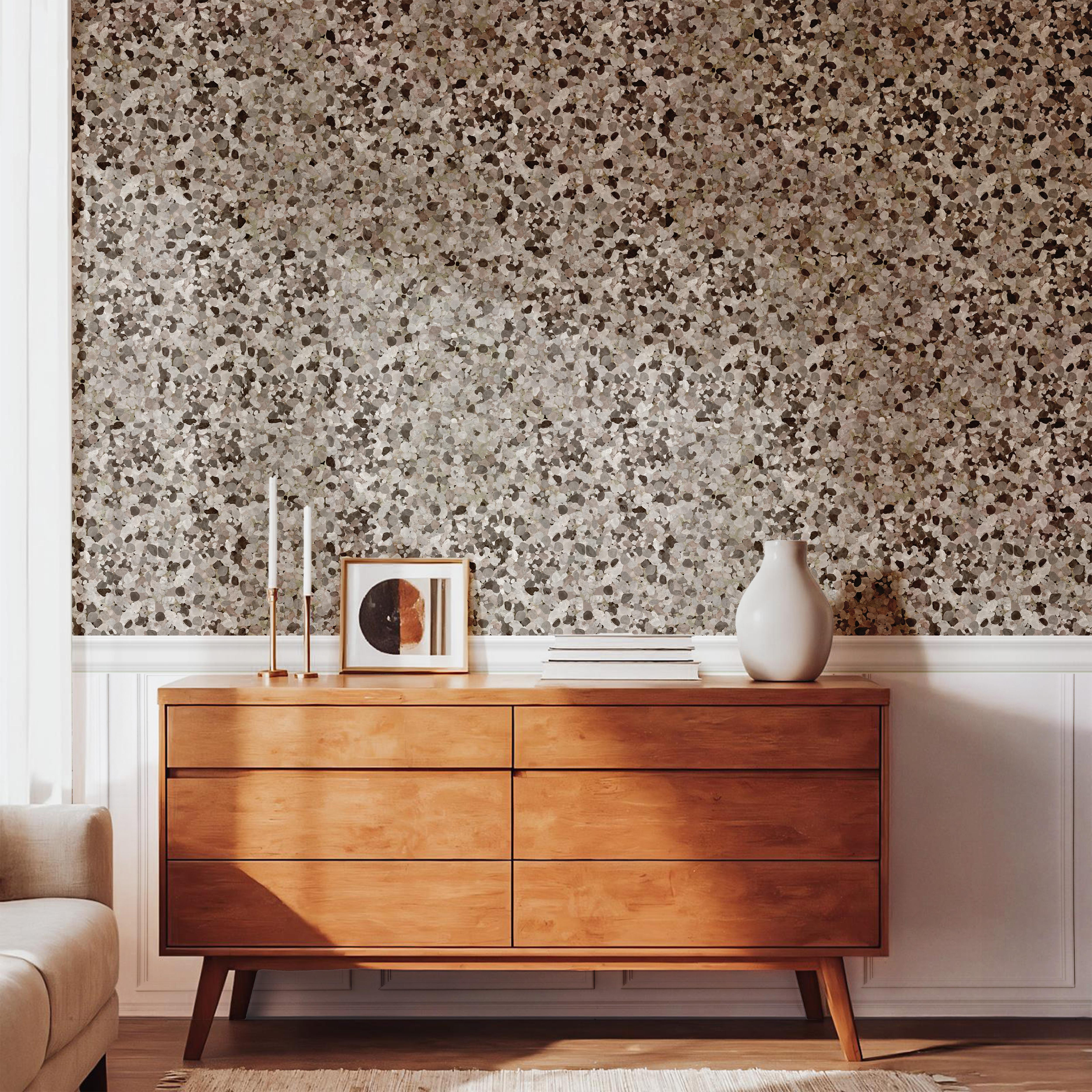living room with ardenwall stone wallpaper behind light wood console and ceramic decor – james & colors