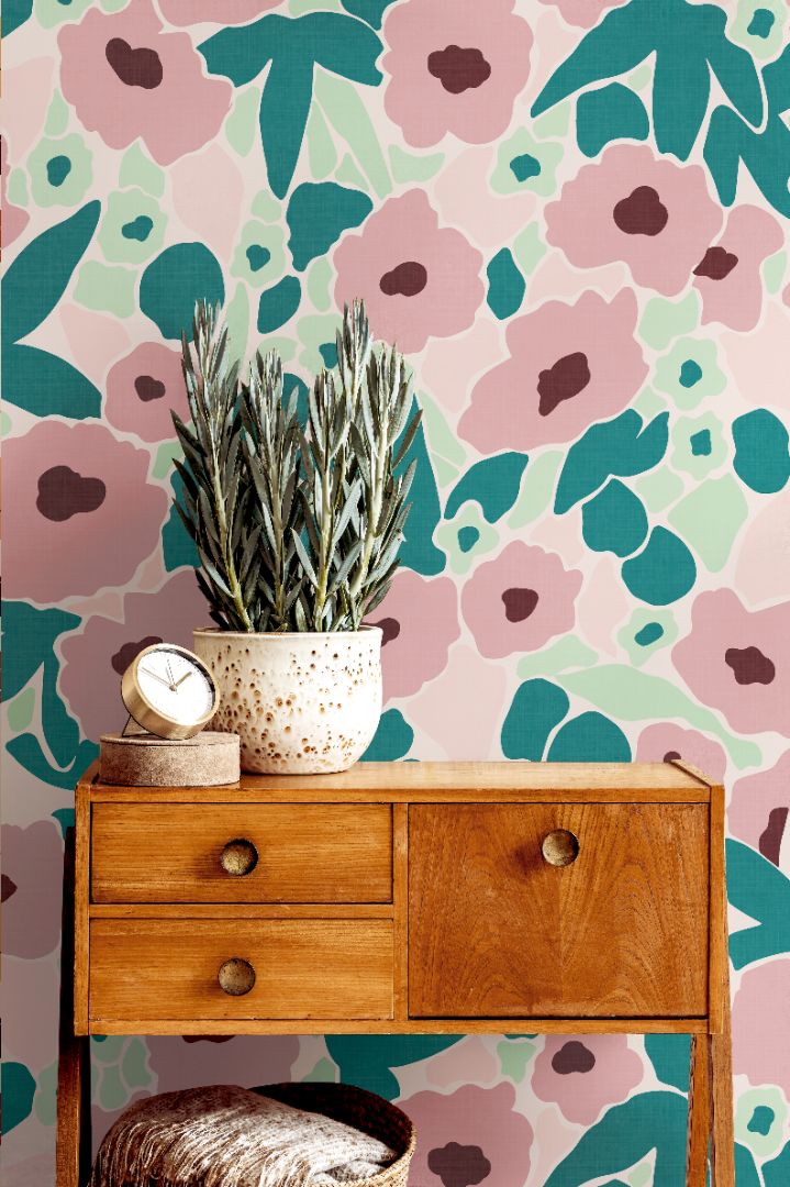 Bedroom wall with Aurora Hour Wallpaper in soft mint and coral tones, adding modern vibrancy and tranquil sophistication.