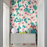 Living room with Aurora Hour Wallpaper featuring vibrant painterly florals in coral, blush, and teal for a lively yet elegant atmosphere.