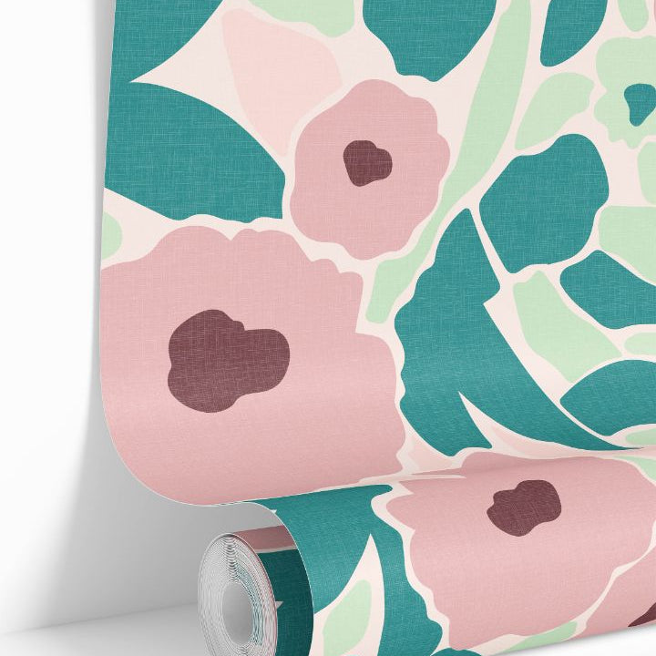 Aurora Hour Wallpaper roll showing painterly florals in coral, teal, and blush tones on a soft mint background.