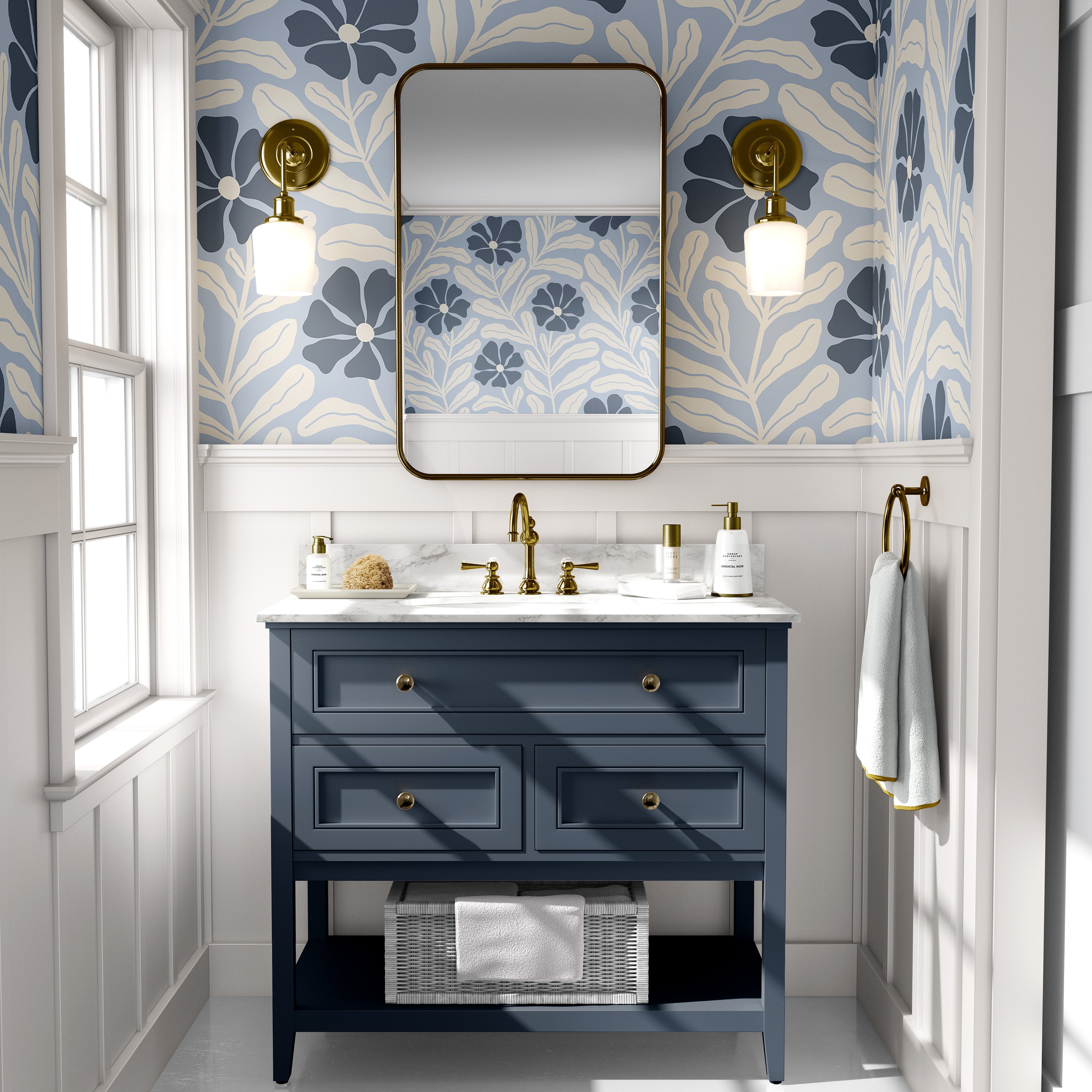 Baywell blue floral wallpaper with navy botanical flowers styled above a blue bathroom vanity with brass fixtures.