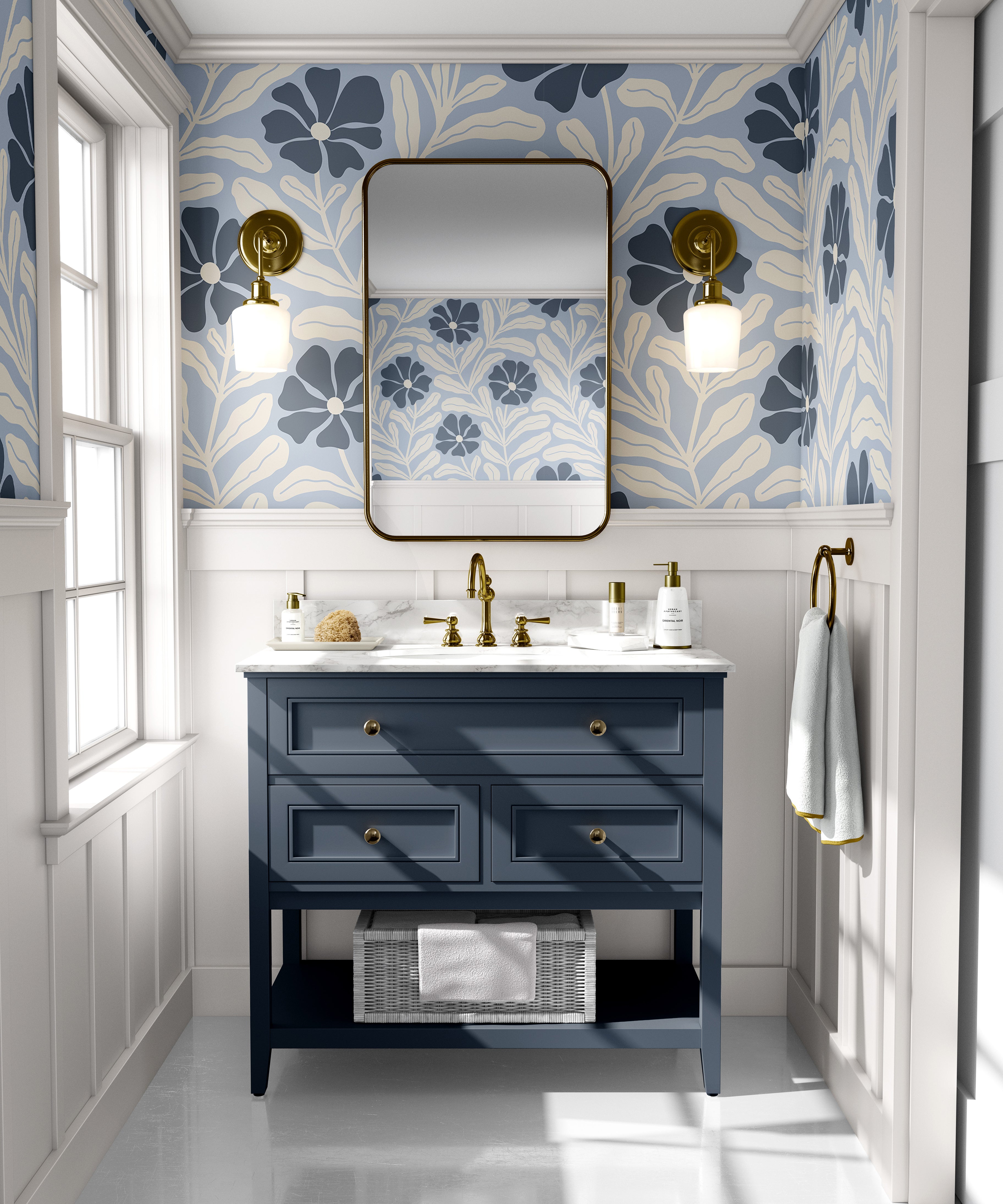 Baywell blue floral wallpaper with navy botanical flowers styled above a blue bathroom vanity with brass fixtures.