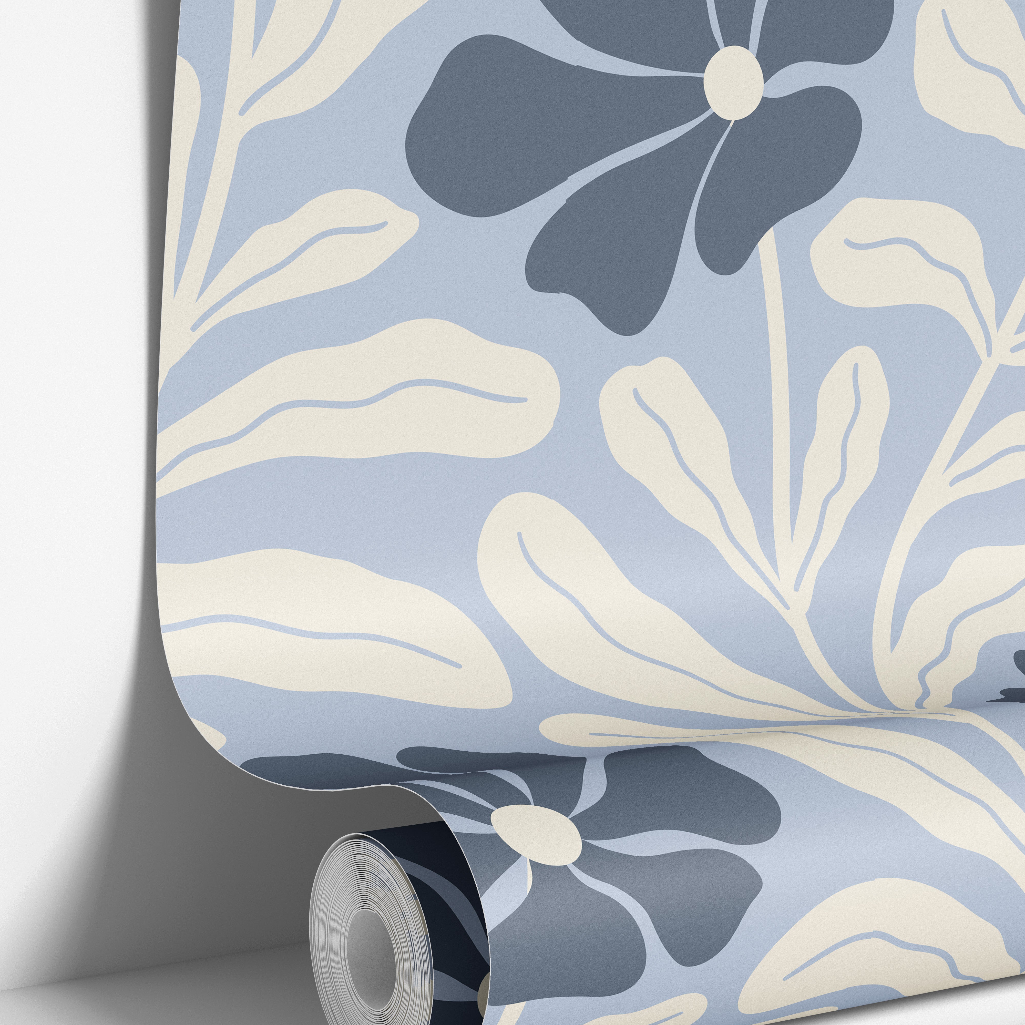 Wallpaper roll mockup of Baywell light blue and navy floral wallpaper with cream botanical leaves by James & Colors.
