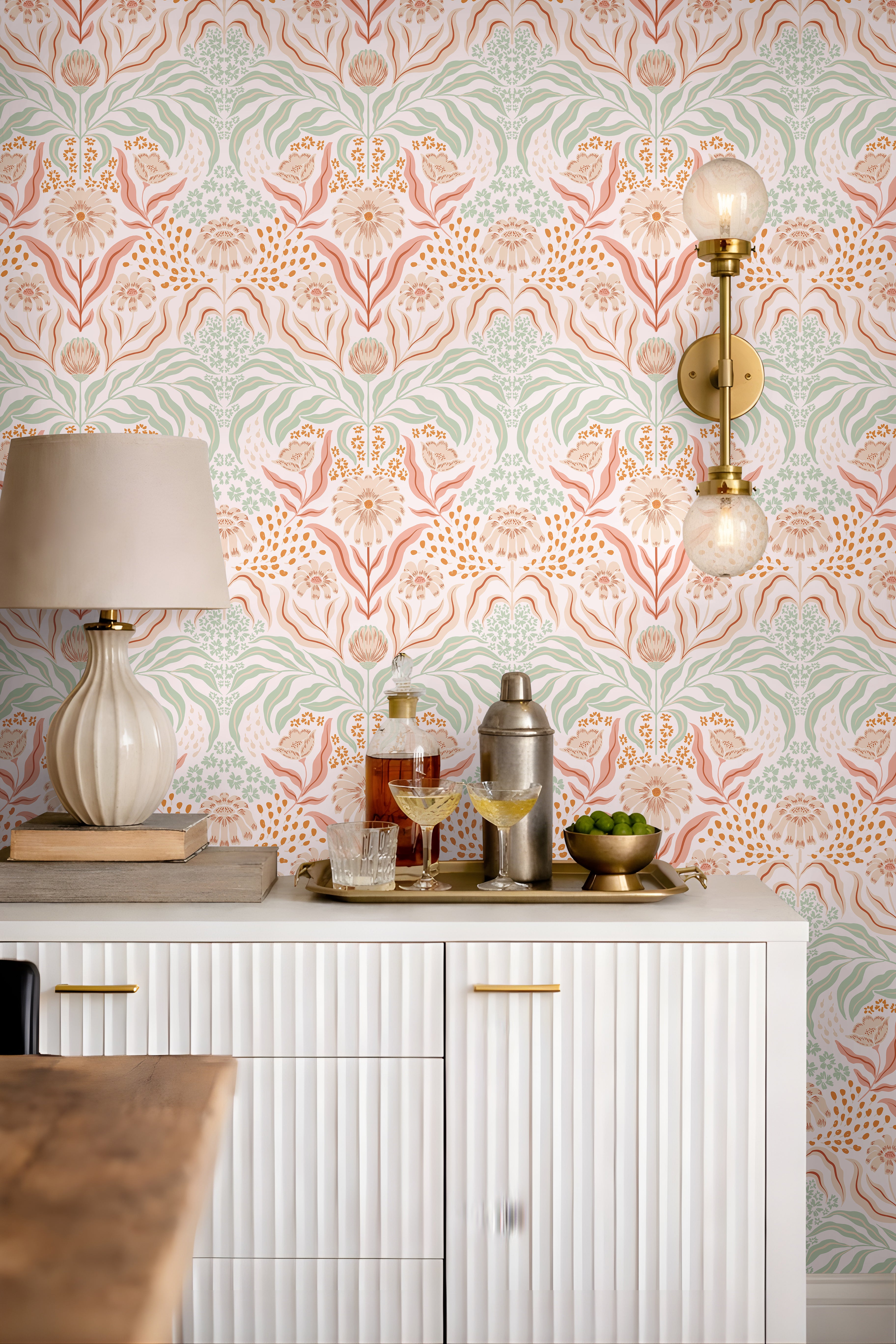 Romantic botanical wallpaper with muted floral pattern in a cozy cottage entertainment room interior.
