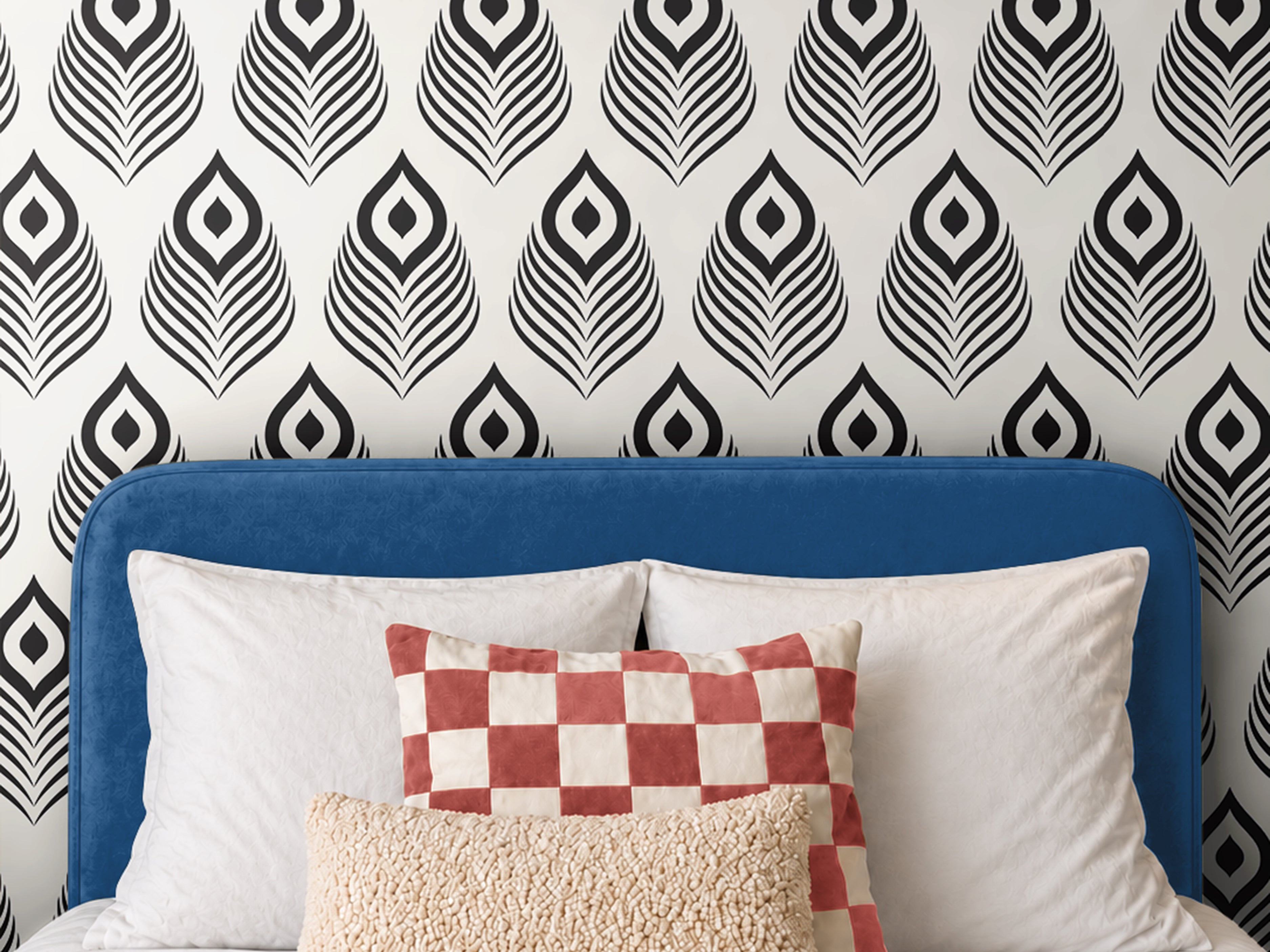 Black Modern 1162 wallpaper featuring a bold black and white geometric peacock feather pattern, styled in a contemporary bedroom with a blue upholstered headboard, white bedding, and decorative accent pillows.