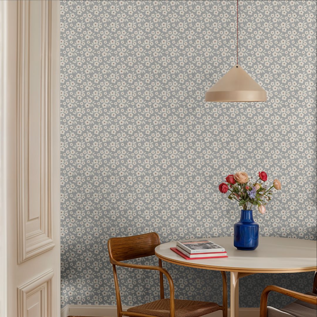 bluebell haven floral wallpaper in modern dining area with blue vase and neutral chairs