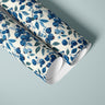 roll of blueberry branches contact paper with blue berries teal leaves and warm cream background