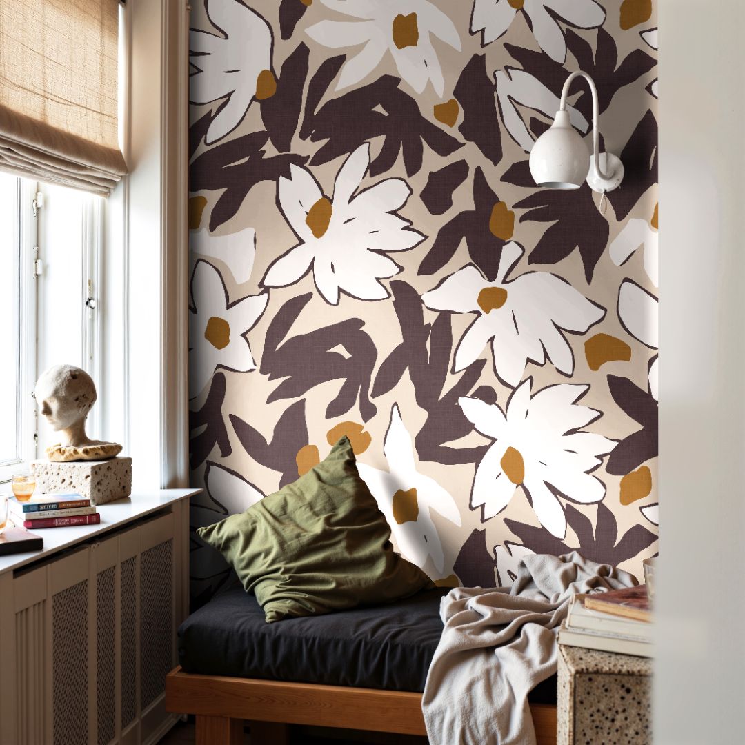 Large-scale floral wallpaper featuring cream petals and warm ochre accents on a rich burgundy ground