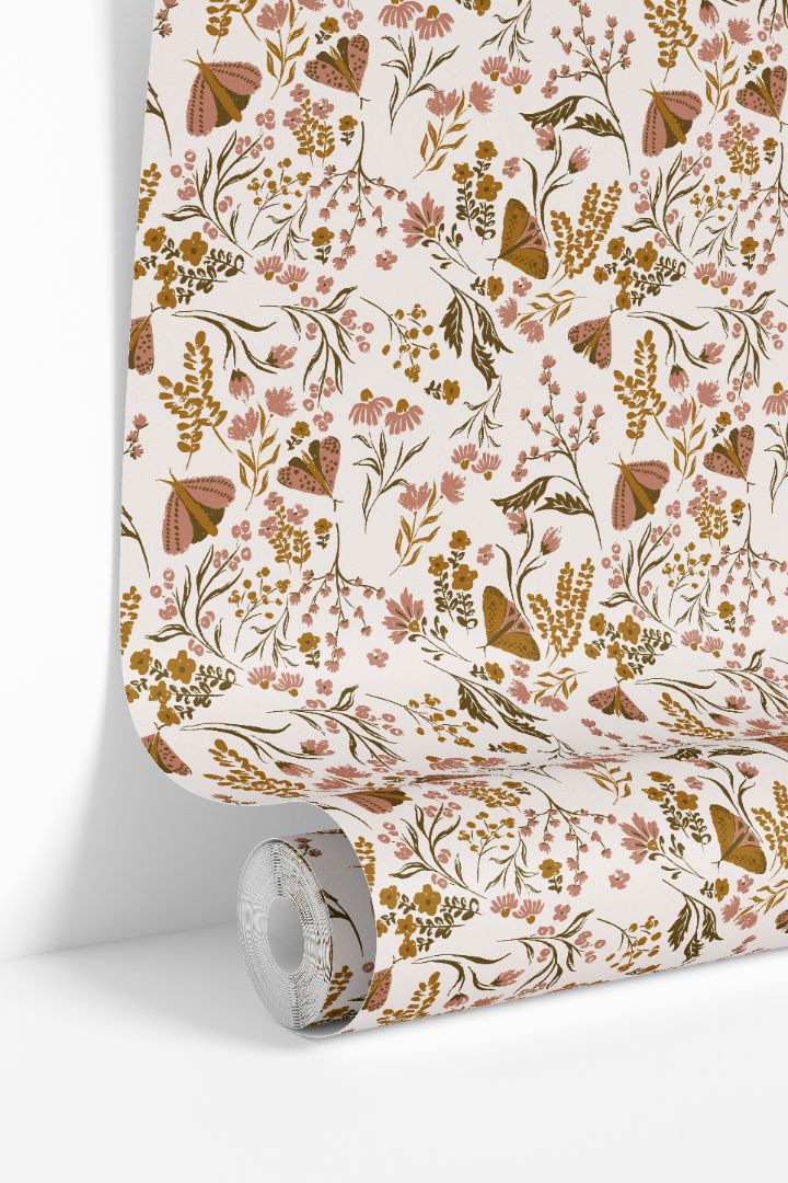 Wallpaper roll displaying Brassmere Wilds botanical wallpaper pattern with wildflowers and butterflies.