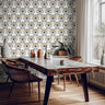 Interior wall styled with Bronzed Fan wallpaper showing repeating bronzed fan shaped florals with indigo details and botanical stems.