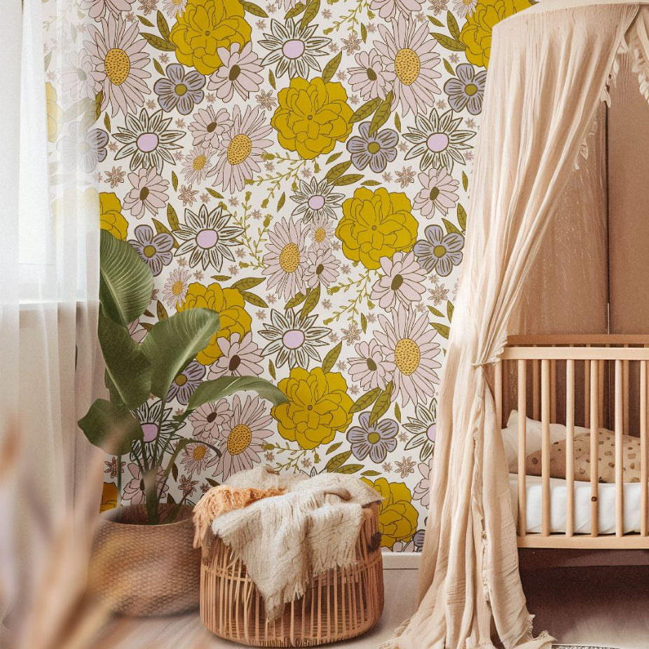 Butterbloom Field Wallpaper in a cozy nursery with warm tones, woven textures, and bohemian decor.
