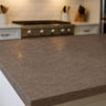 Close up of Canyon Clay terrazzo countertop film 85 showing warm brown stone flecking