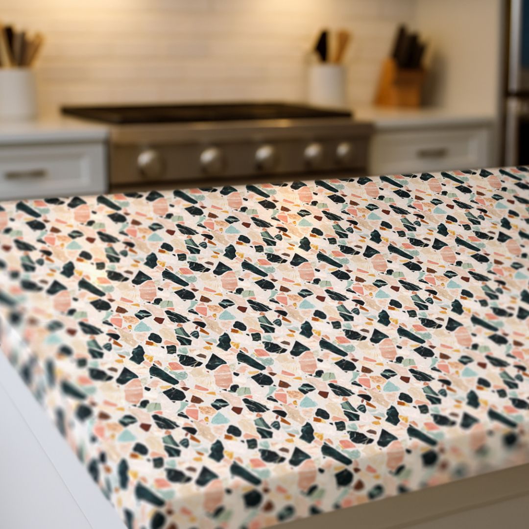 Capri Stone Countertop Film in a modern kitchen featuring terrazzo-inspired coral, jade, and charcoal tones.