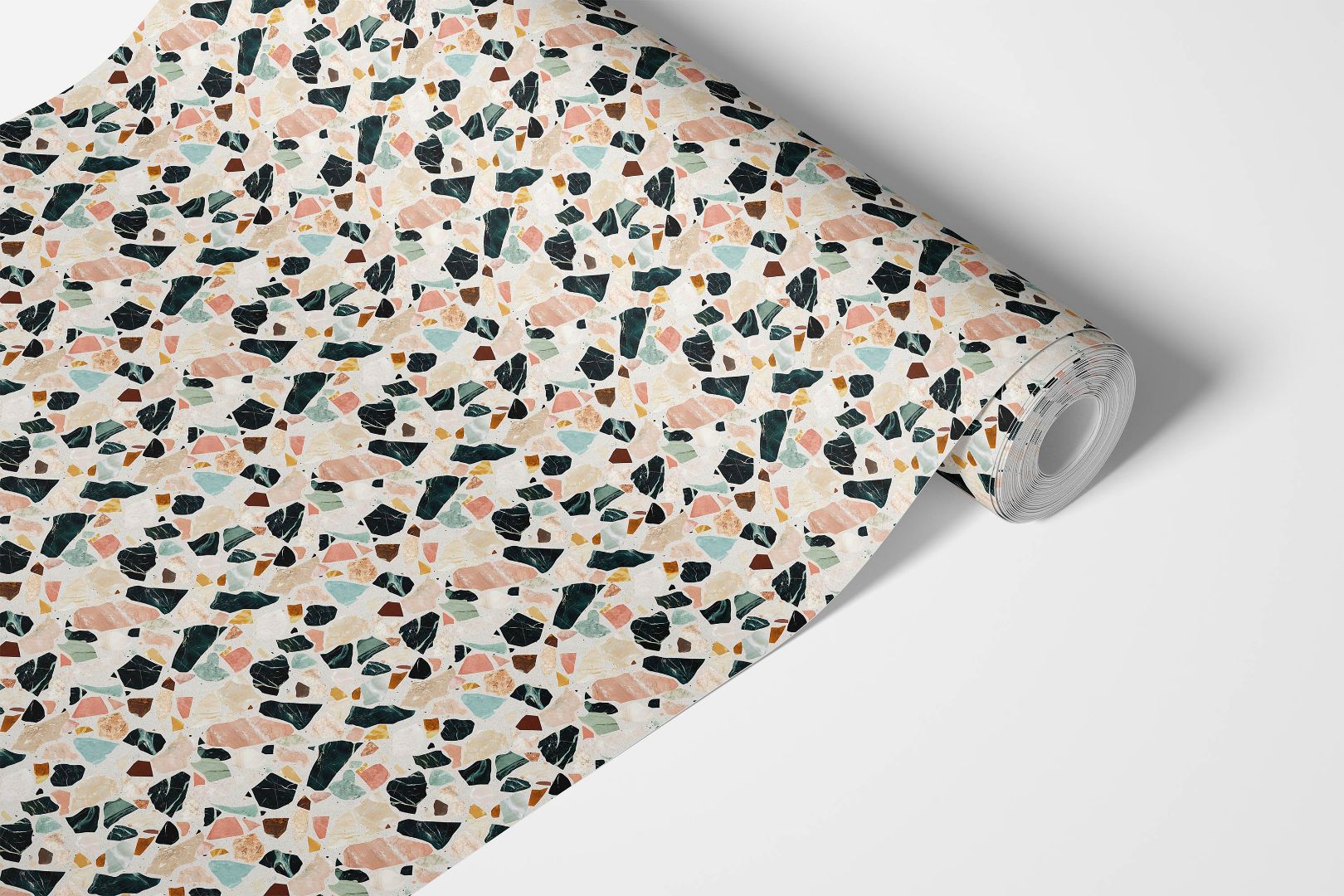 Roll of Capri Stone Countertop Film showcasing terrazzo-style pattern with coral, jade, and sand accents.