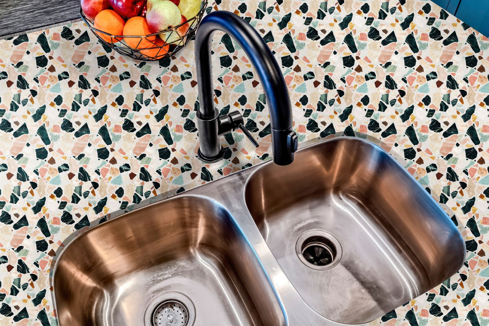 Capri Stone Countertop Film applied around stainless steel sink with warm terrazzo tones for a stylish modern upgrade.