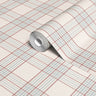Soft blush plaid peel and stick contact paper with pale blue striping styled as a rolled surface display on a neutral background.