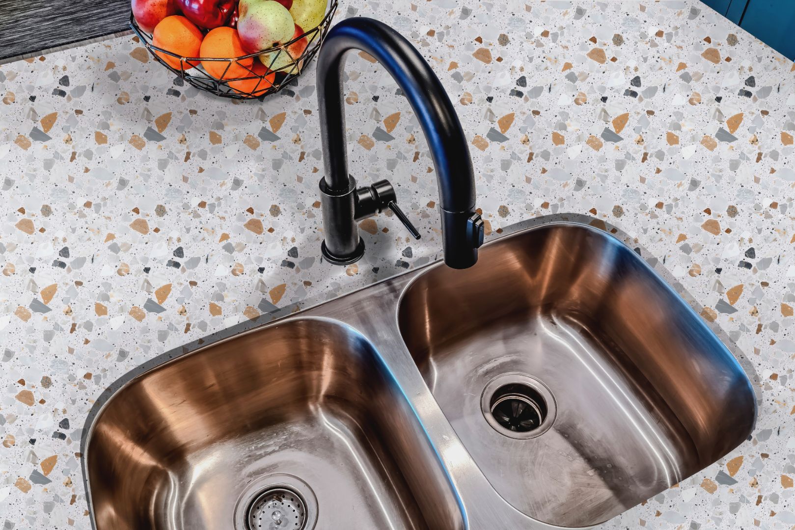 Cielo Terra Countertop Film applied around a stainless steel sink, adding subtle color and texture to the surface.