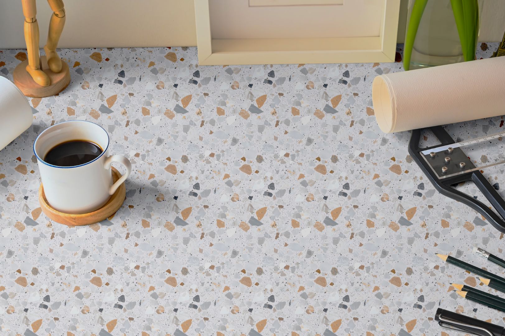 Cielo Terra Countertop Film in a modern workspace setting, showing terrazzo-inspired design with gray, tan, and white tones.