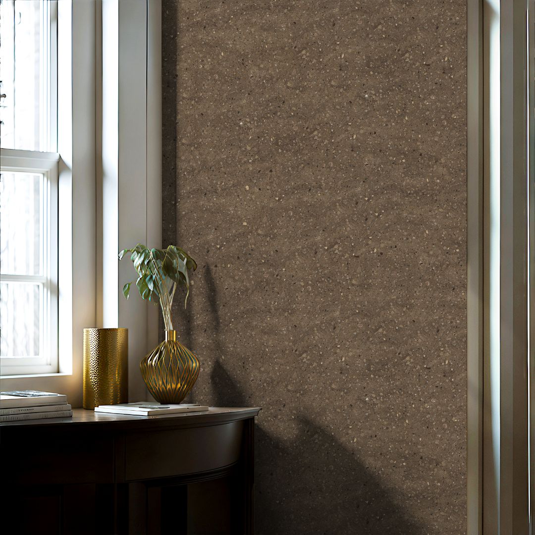 Warm beige terrazzo wallpaper with subtle speckled texture in a minimalist interior space