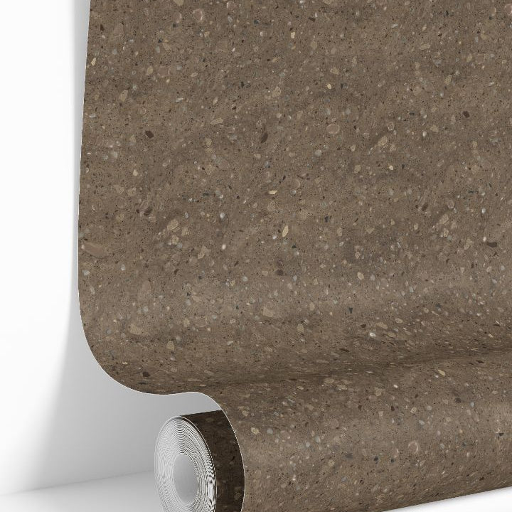 Clay Canyon Collective terrazzo wallpaper roll showing warm neutral stone speckled pattern
