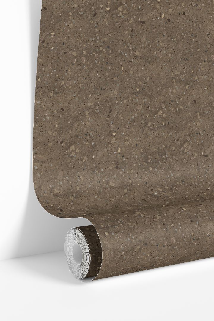 Clay Canyon Collective terrazzo wallpaper roll showing warm neutral stone speckled pattern