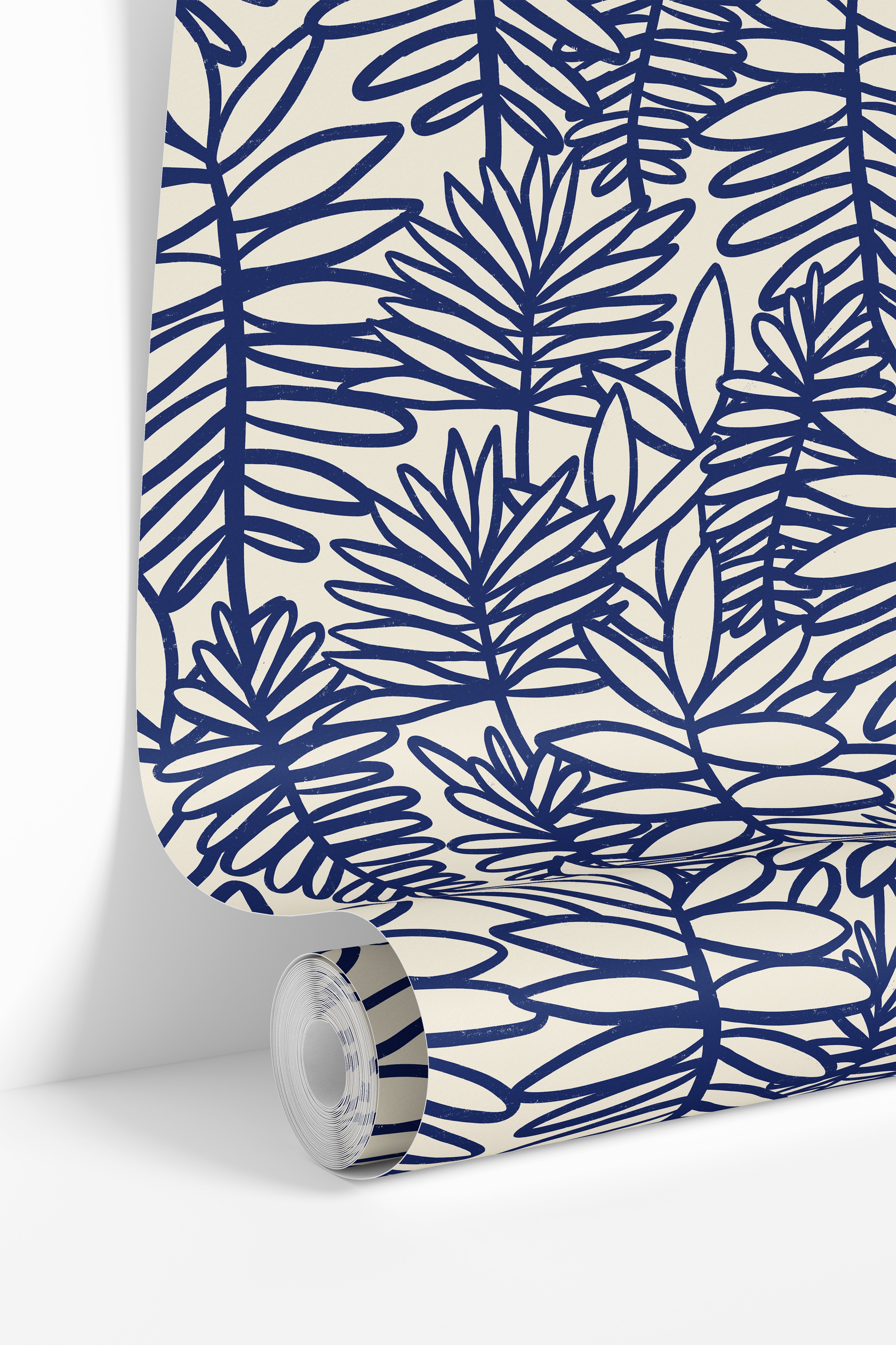 Wallpaper roll featuring Coastal Theory blue botanical wallpaper with oversized tropical foliage.
