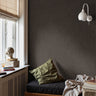 modern interior with dark brown slate wallpaper creating moody architectural texture