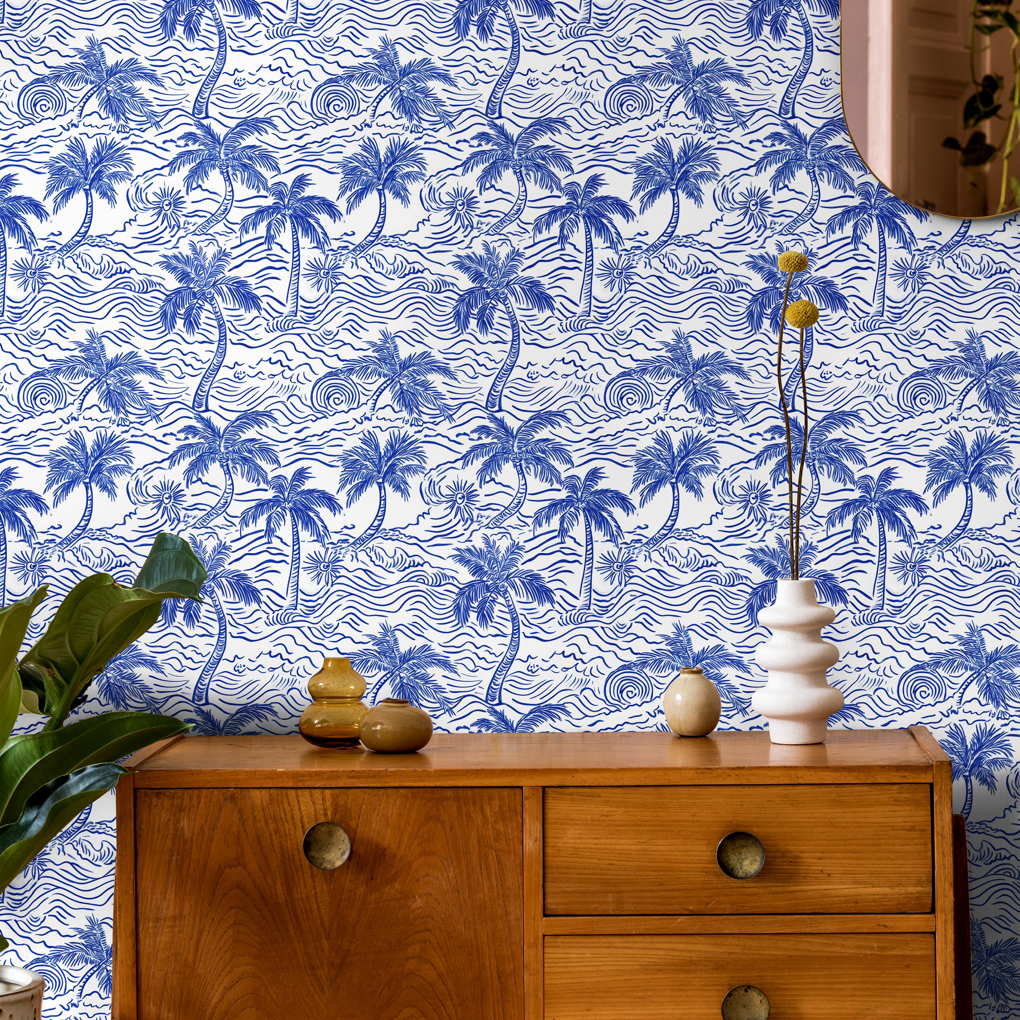 Blue and ivory coastal palm wallpaper in a vintage inspired office featuring wood furniture and nautical decor