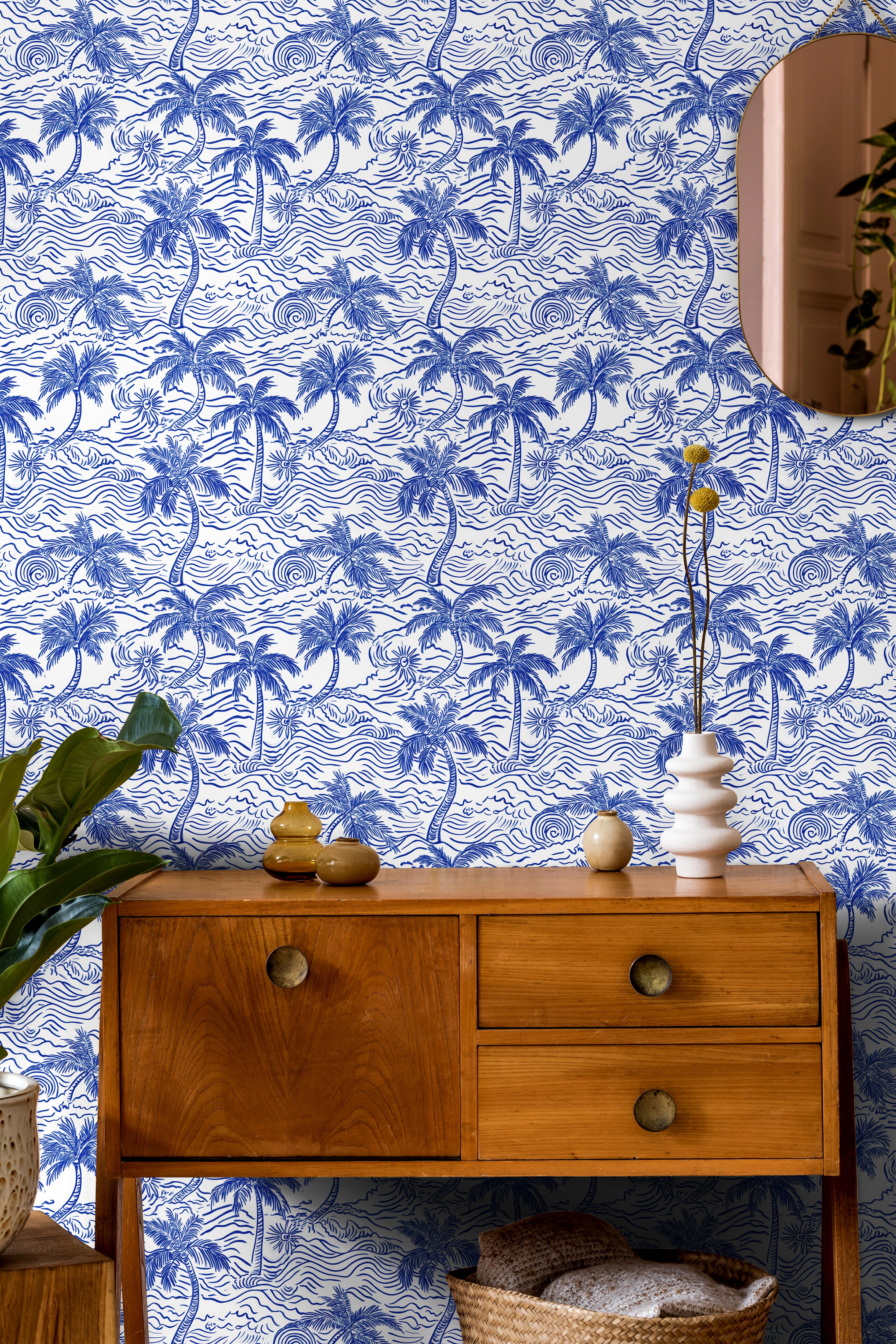 Blue and ivory coastal palm wallpaper in a vintage inspired office featuring wood furniture and nautical decor