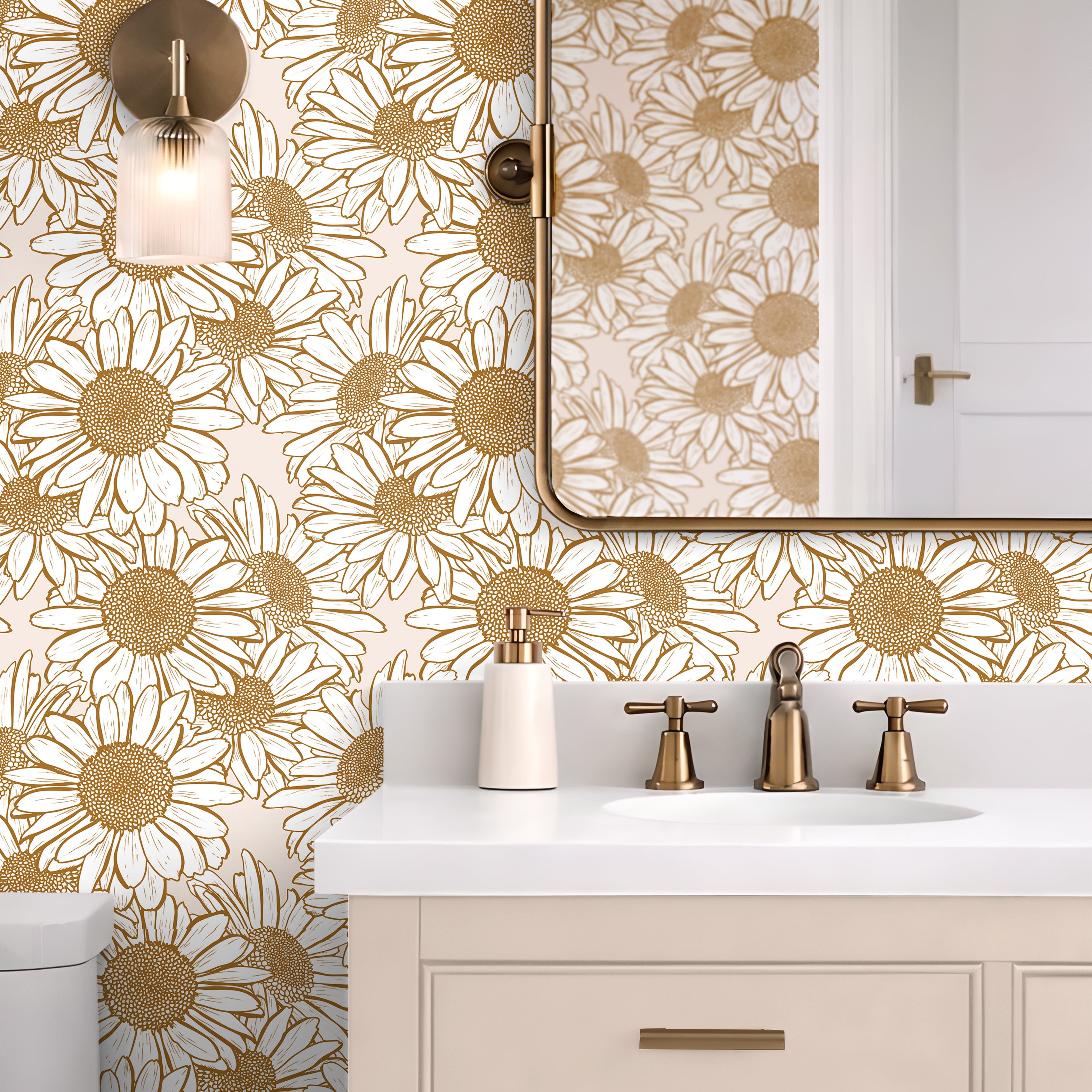 Daisy Hour botanical wallpaper with golden daisy linework styled in a bright bathroom with brass fixtures and cream cabinetry.
