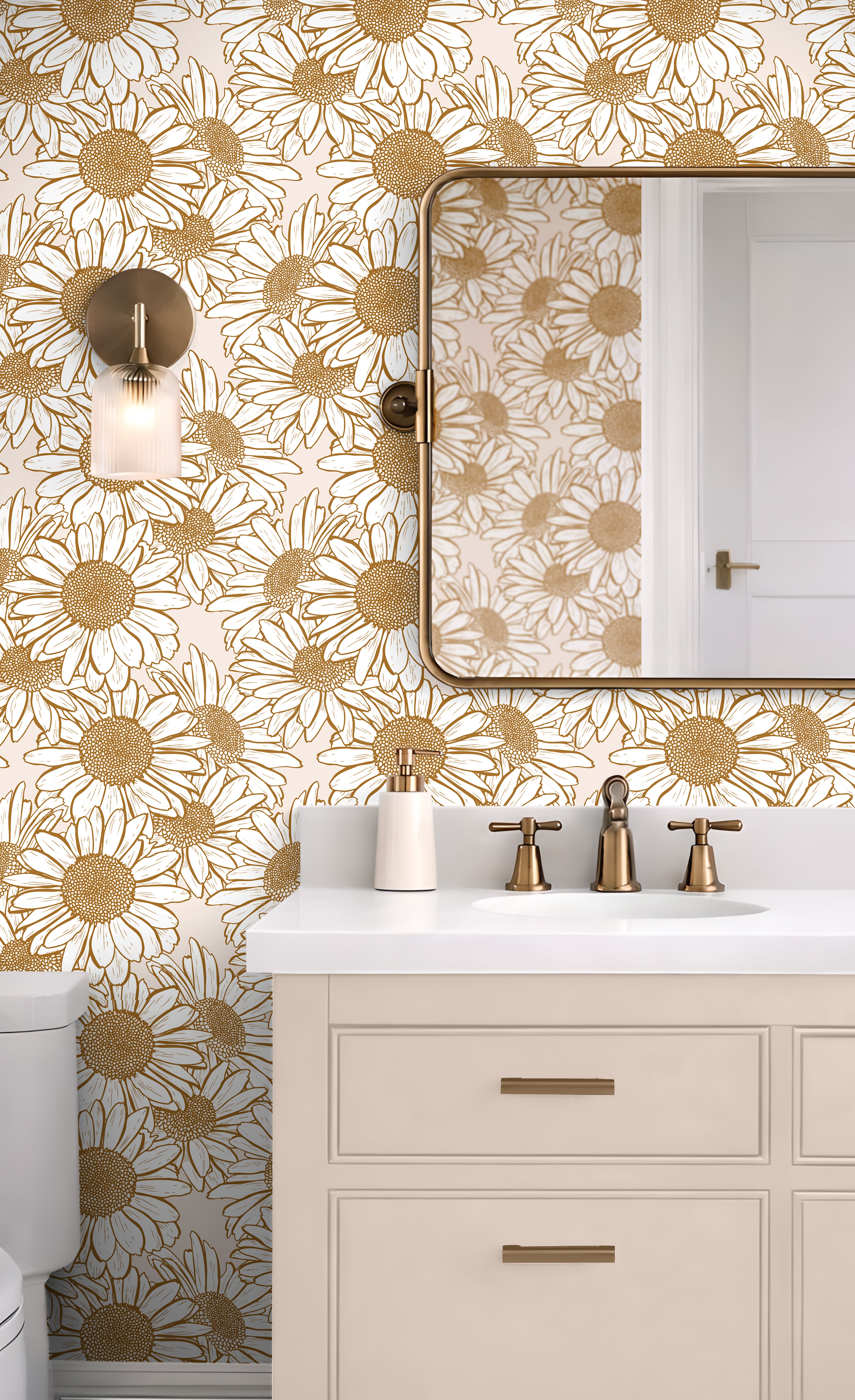 Daisy Hour botanical wallpaper with golden daisy linework styled in a bright bathroom with brass fixtures and cream cabinetry.
