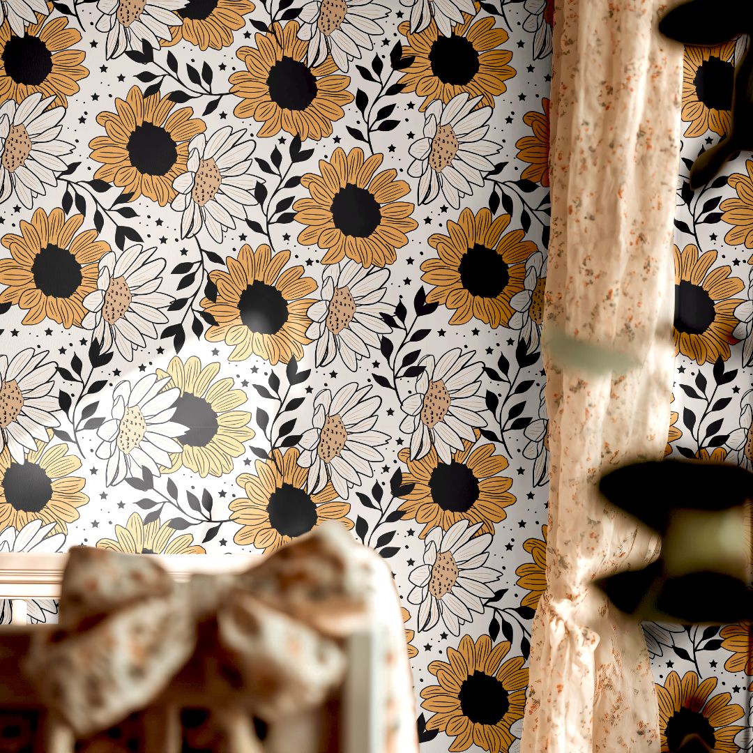 daisy noir floral wallpaper in golden yellow tones styled in cozy nursery with patterned curtains