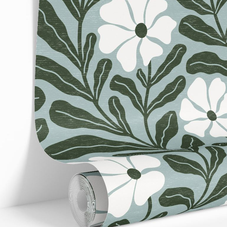 Wallpaper roll showing Driftwell cool green floral botanical pattern repeat